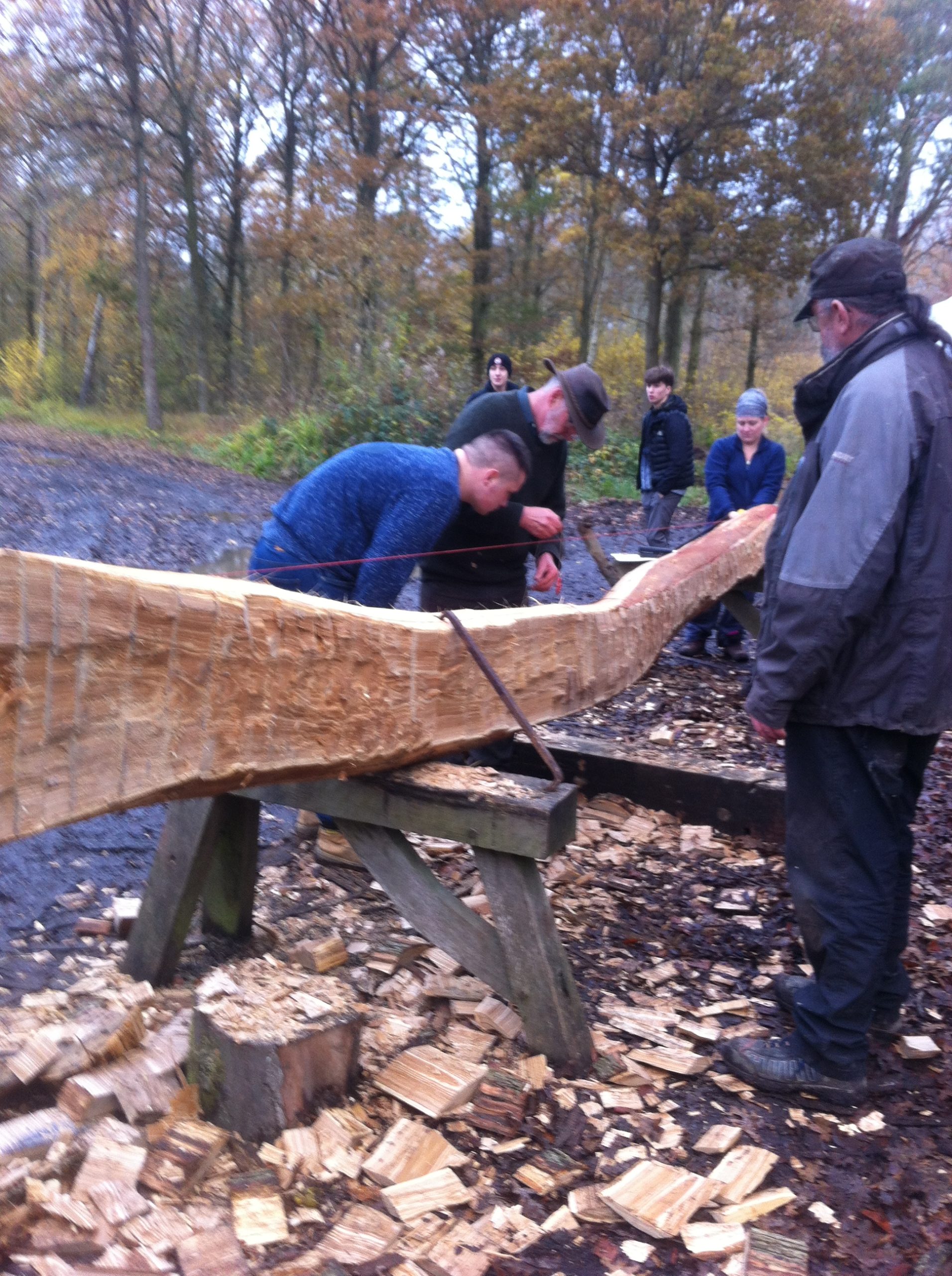 West Suffolk College students sawing timber